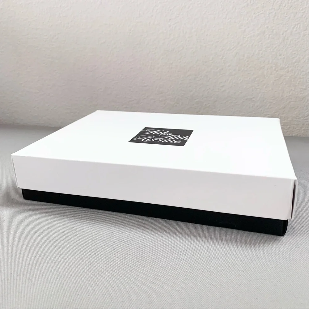 Hold Saks Fifth Avenue gift boxes